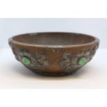 Arts and Crafts style bowl, with beaten pewter foliate decoration, 23cm diameter