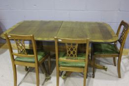 Walnut veneered extending dining table, the D shaped ends with reeded frieze, raised on two turned