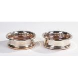 Pair of 19th Century silver plate on copper wine bottle coasters, each with wooden bases, 15cm