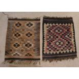 Two Anatolian rugs, each centred with a geometric pattern, 85cm long x 65cm wide and 92cm long x