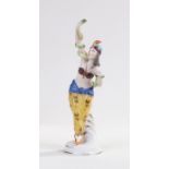 Porcelain figure, of a belly dancer holding a snake, gold anchor mark to the back, 21.5cm high