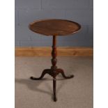Mahogany circular top occasional table, on a turned stem, tripod legs and pad feet, 51.5cm diameter