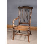 Arts and Crafts style cane seated armchair, with spindle back rest, 98cm high