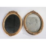 Two 19th Century oval framed mirrors, each housed within gilt frames and mounted with floral