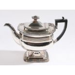 George III style silver plated tea pot, the hinged lid with beaded border above scallop decorated