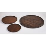 19th Century mahogany circular tray, 45cm diameter, together with two other circular trays