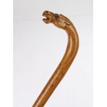 19th Century novelty walking stick, the grip carved with a horses head set with glass eyes, 87cm