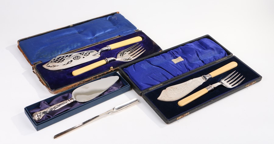 Two pairs of silver plated fish servers, each in fitted cases, together with a silver plated