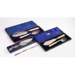 Two pairs of silver plated fish servers, each in fitted cases, together with a silver plated