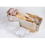 Armand Marseille bisque headed doll, with brown eyes, stamped 12' DEP, Made in Germany to the back