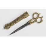 Pair of French 19th Century brass and steel scissors, the handles with lion mask and scroll