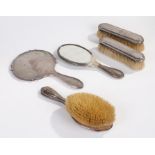 George V silver hand mirror, Birmingham 1927, together with a pair of similar brushes, London
