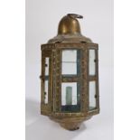 Brass hanging lantern, with a dome top above the glazed case with a hinged door, 38cm high