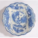 18th Century Dutch Delft dish, of small proportions, with chinoiserie decoration and gadrooned edge,