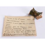 Fragment of a pottery handle with a label stating " Pottery of the 15th Century - found near