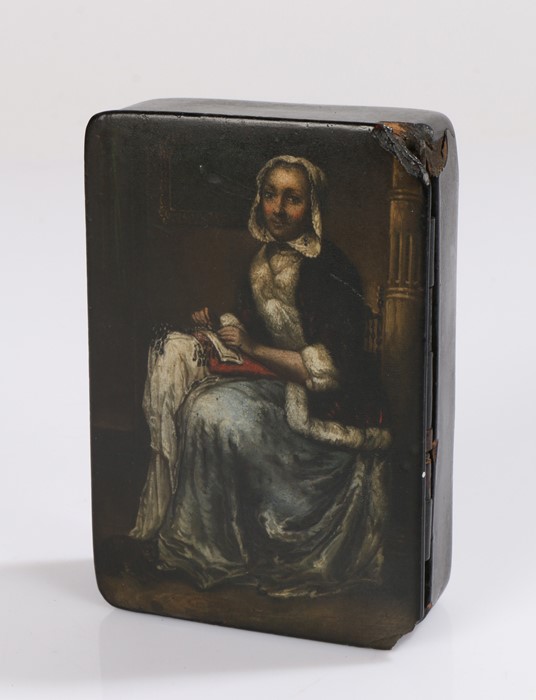 19th Century papier mache snuff box, the lid decorated with a seated lady working on her needlework,