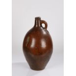 18th Century pottery salt glaze jug, with a short neck and handle above the bulbous body impressed