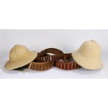 Two pith helmets, together with three shotgun cartridge belts, (5)