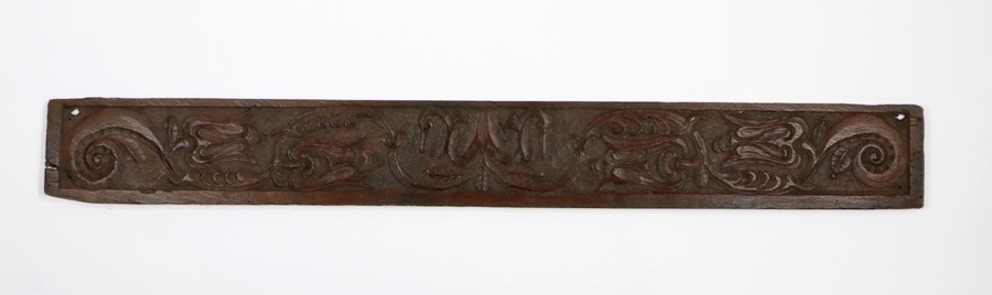 17th Century carved oak panel, with stylised tulips and scrolls, 137cm x 17cm