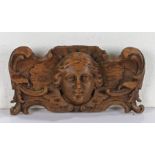 18th Century carved oak section, with a bust flanked by acanthus leaf scrolls, 33cm wide