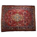 Persian Feragham carpet ,the central medallion with flowers within a red foliate surround and four