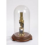 19th Century brass monocular microscope, with a Starch Arrow Root slide housed under a glass dome