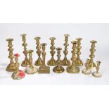 Collection of 19th Century brass candlesticks, to include six pairs and two singles, (14)