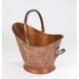 Victorian copper coal scuttle, with a helmet shaped body and hinged loop handle. 39cm long