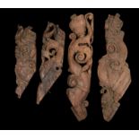 Four 18th Century Indian carved corbel brackets, the four pieces carved with scrolls and fish,