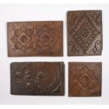 Four 17th/18th Century oak panels, the first with an diamond and leaf design 19cm wide another