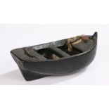 19th Century folk art toy boat, the dug out boat with nailed in sets and twine to the bow, 20.5cm