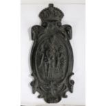 Iron lamp post plaque, with the crown above Britannia on horseback reaching to help, 71cm high