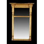 Regency gilt gesso pier mirror, the concave top above beads and star capitals above half columns