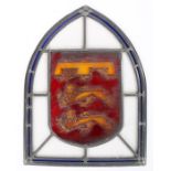 19th Century stained glass panel, the arched plate with a central crest featuring two rampart lions,