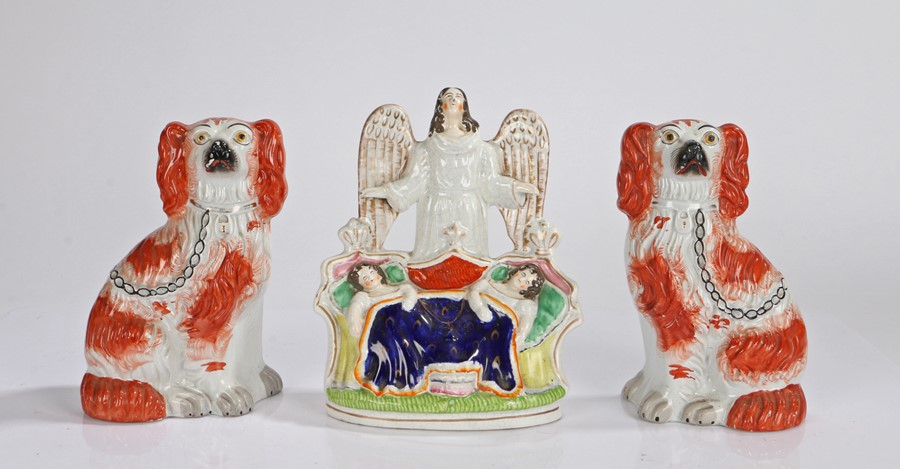 Pair of 19th Century Staffordshire spaniels, 22cm high, together with a Staffordshire figure of an