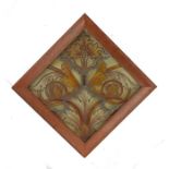 19th Century stained glass panel, with leaf and flower head design, housed in a cushion moulded pine