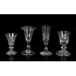 Four miniature 19th Century glasses, two include three wine glasses and one flute, 6cm to 9cm