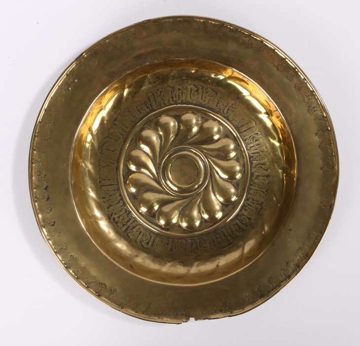 17th Century Nuremburg brass alms dish, with central ornate boss within a band of Gothic script, the