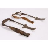 Pair of Ethnographical implements, possibly African with rounded curved spear type ends and