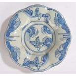 18th Century Dutch Delft dish, with chinoiserie decoration and gadrooned edge, 21.5cm diameter