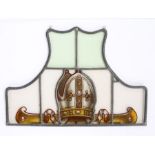Stained glass panel, the arched panel with a Bishops Mitre in red, 48cm x 34cm