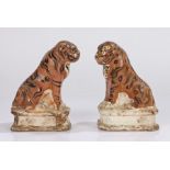 Unusual pair of 19th Century pottery incense or taper stands, each a seated tiger on a white
