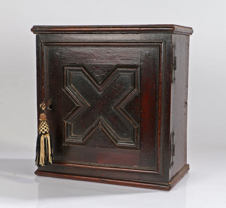 17th Century oak spice cabinet, the rectangular cabinet with a geometric panel cupboard door