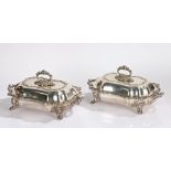 Pair of silver plated entrée dishes, with acanthus leaf handles above the scroll and acanthus leaf