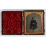 19th Century sixth plate ambrotype, of a boy in dress, housed within the original case