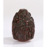 Finely carved 18th Century coquilla nut, the richly coloured nut carved as baby Moses in the