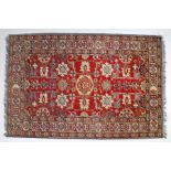 Anatolian Dozar rug with a red field and geometric flower design between a trio of borders, 119cm