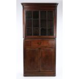 George III mahogany standing corner cabinet, the concave cornice above an astragal glazed doors