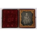 19th Century sixth plate daguerreotype of a girl, seated on a chair wearing a dress, cased