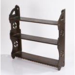 Victorian Gothic revival mahogany hanging shelves, with three shelves flanked by four clover pierced